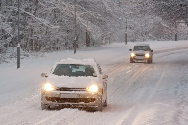 image of a car driving in the winter