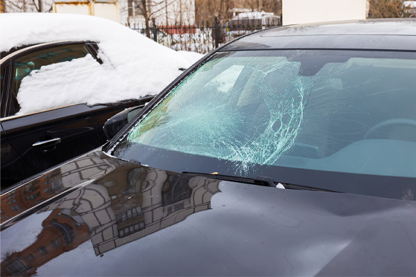 image of a cracked windshield in the snow