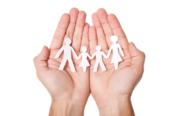 image of family paper cutout in hands depicting auto glass safety