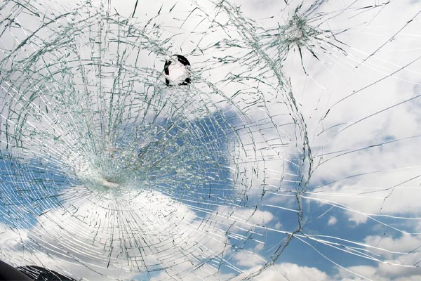 image of a shattered windshield that needs a windshield replacement