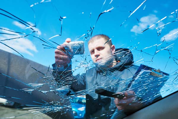 image of an auto glass technician performing an auto glass replacement quote in hometown pennsylvania