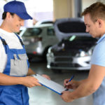 image of auto glass technician offering auto glass replacement quote to pennsylvania driver