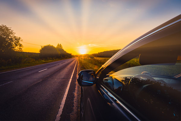 driving in summer depicting windshield repair service