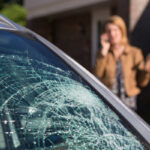 woman dealing with a cracked windshield