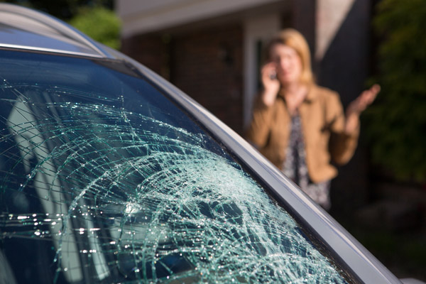 woman dealing with a cracked windshield