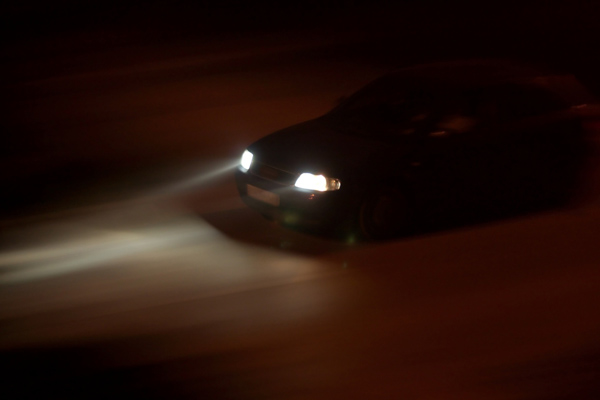 car driving with foggy headlights
