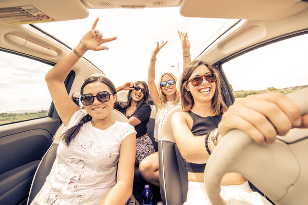 image of friends on a road trip during summer