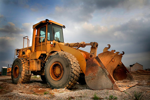 excavator with windshield damage