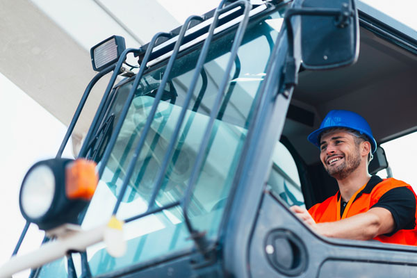 image of construction equipment that needs a windshield repair