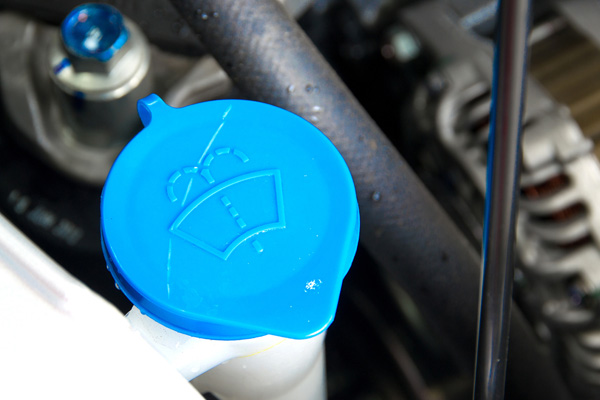 image of windshield wiper fluid of a car