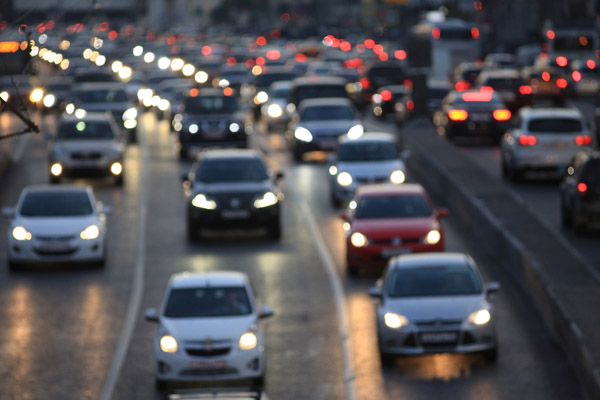 cars driving on freeway depicting affect on car glass