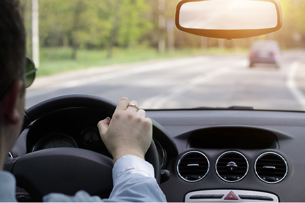 man driving in car avoiding damaging windshield