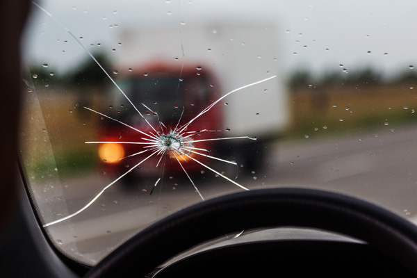 image of a windshield crack while driving