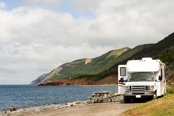 RV driving on sandy road