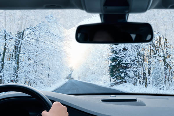 image of a car driving in winter weather