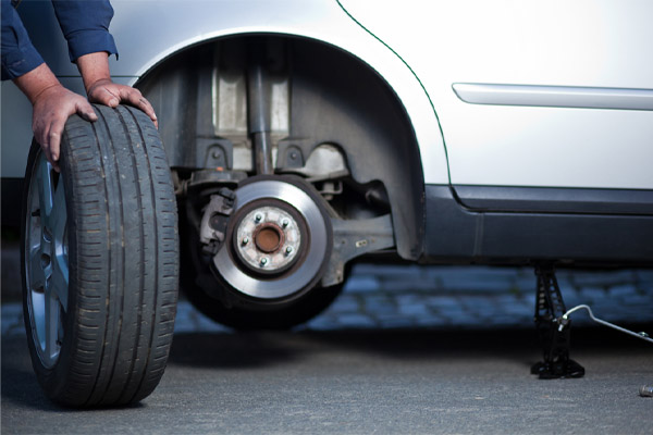 mechanic changing a wheel of a commercial vehicle