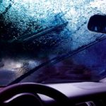 image of a car in rain depicting a windshield leak