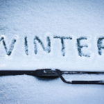 image of the word winter on windshield depicting winter windshield damage