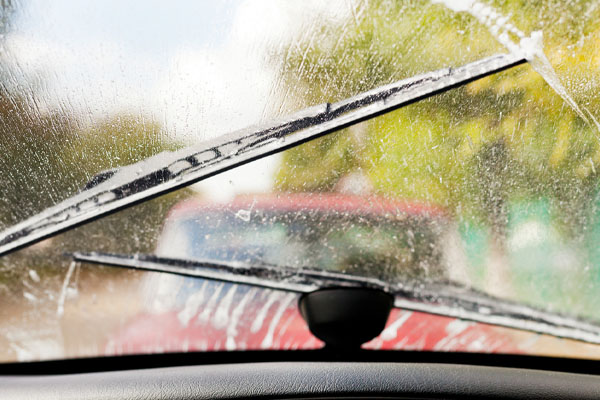 driving in the rain depicting squeaky windshield wipers