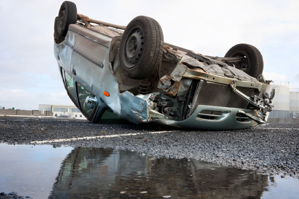 image of car rollover depicting car windshield safety