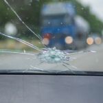 image of a damaged windshield after rock hit windshield