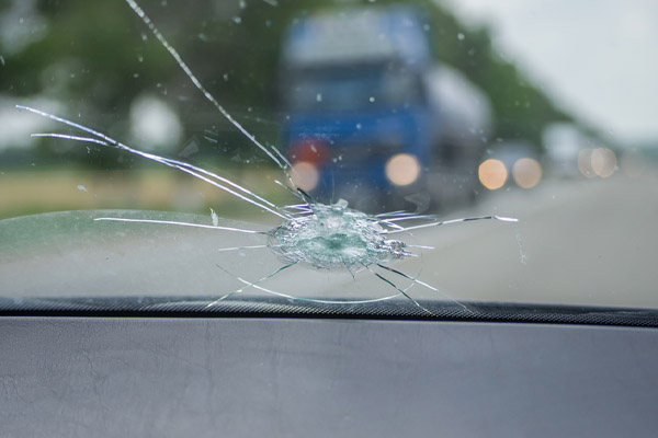 image of a damaged windshield after rock hit windshield