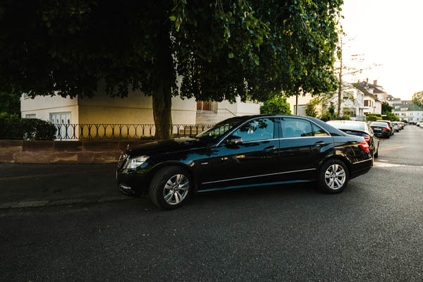 image of car parked under tree for shade