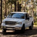 image of a pickup truck in forest depicting pickup truck glass repair