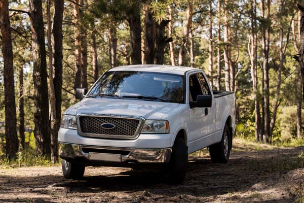 image of a pickup truck in forest depicting pickup truck glass repair