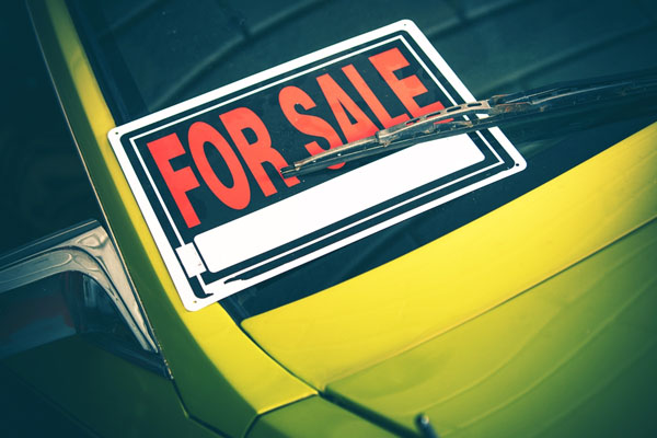 image of a car with for sale sign depicting auto glass and car resale value
