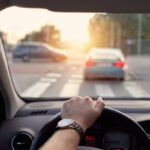 image of a driver and windshield depicting auto glass protection