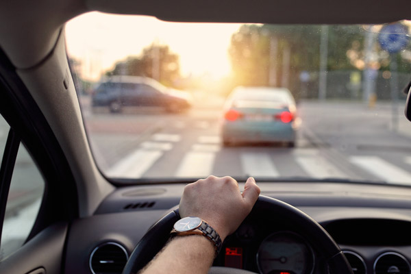 image of a driver and windshield depicting auto glass protection