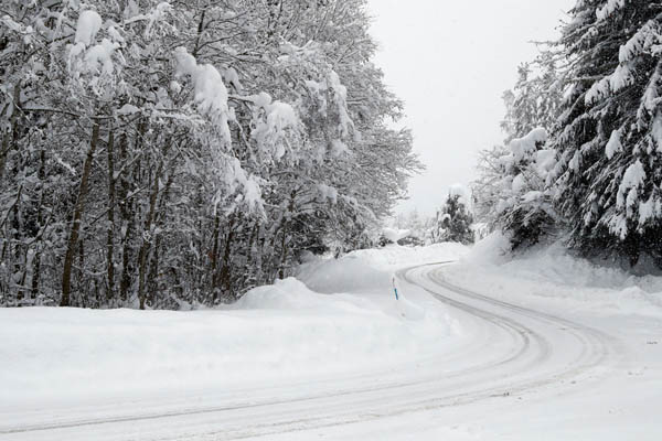 image of a winter road and poor driving conditions