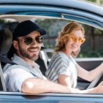 happy couple in car depicting auto glass accessories