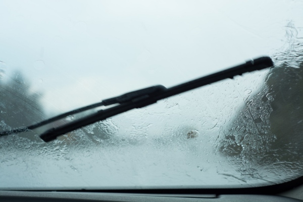windshield and wiper blade under heavy rain