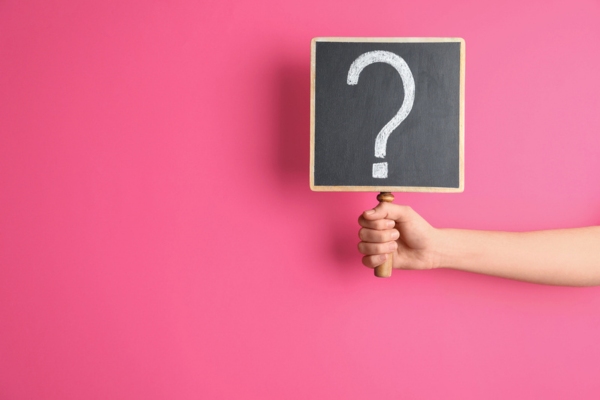 question mark sign held up depicting FAQs about OEM Windshield Replacement